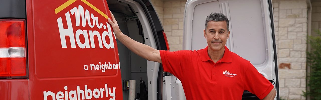 Service professional at the back of a service van.