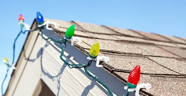 Close-up of Christmas lights on a roof.