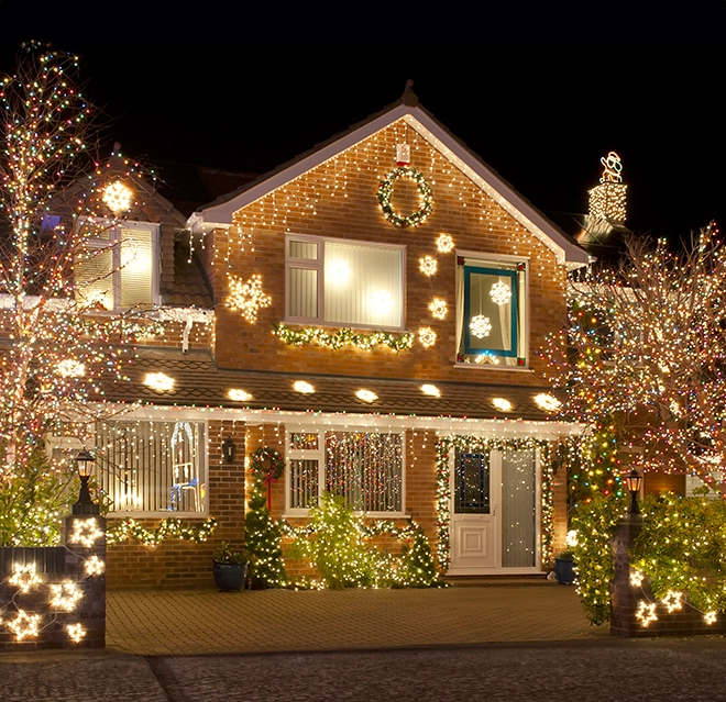 Christmas lights adorning home exterior.