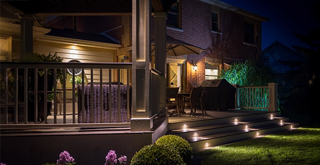Cozy illuminated patio at night with soft lighting enhancing the ambiance.