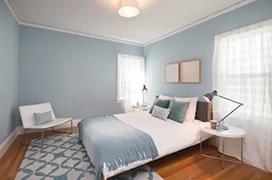 Neat blue bedroom.