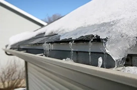 Thawing icy gutters.