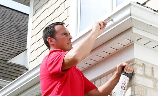 Mr. Handyman fixing a gutter.