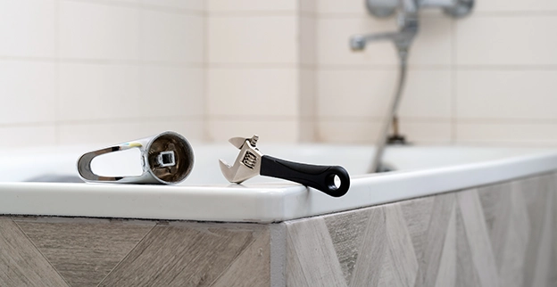 A picture of a bathtub in the process of being installed.