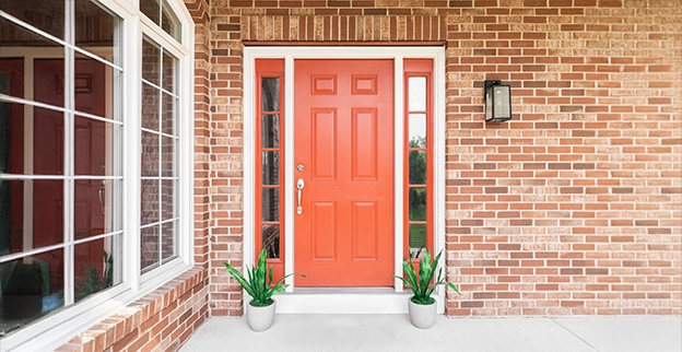 A picture of a red-painted front door to a home.