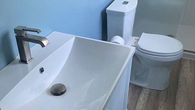White bathroom sink and toilet.