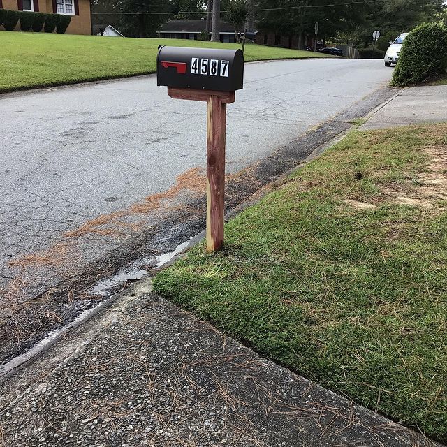 Black mailbox with numbers installation