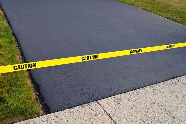 Caution sign at end of driveway