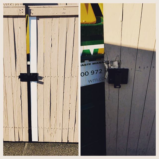 New lock on store's dumpster gate.
