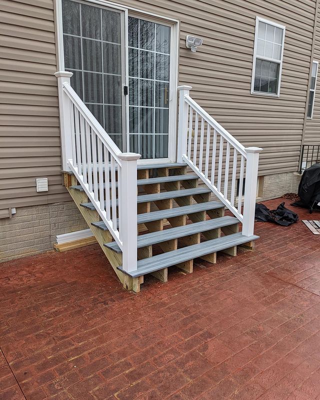 Sliding doors leading to an outdoor staircase