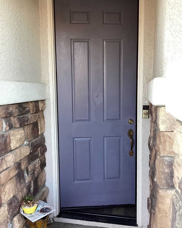 Dark blue door refinished.