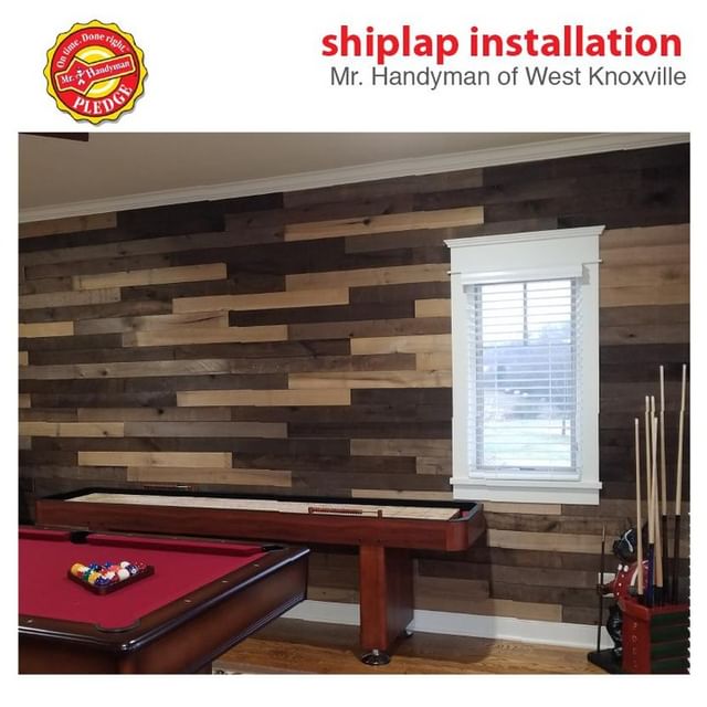 Game room with wooden-paneled walls