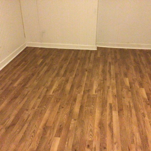 Hardwood floor with light colored wood in bedroom