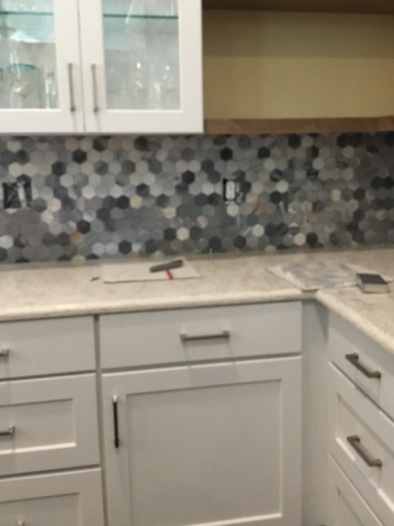 Kitchen cabinets and backsplash installation