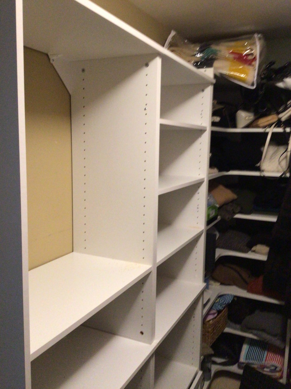 Installed white closet organizer in closet