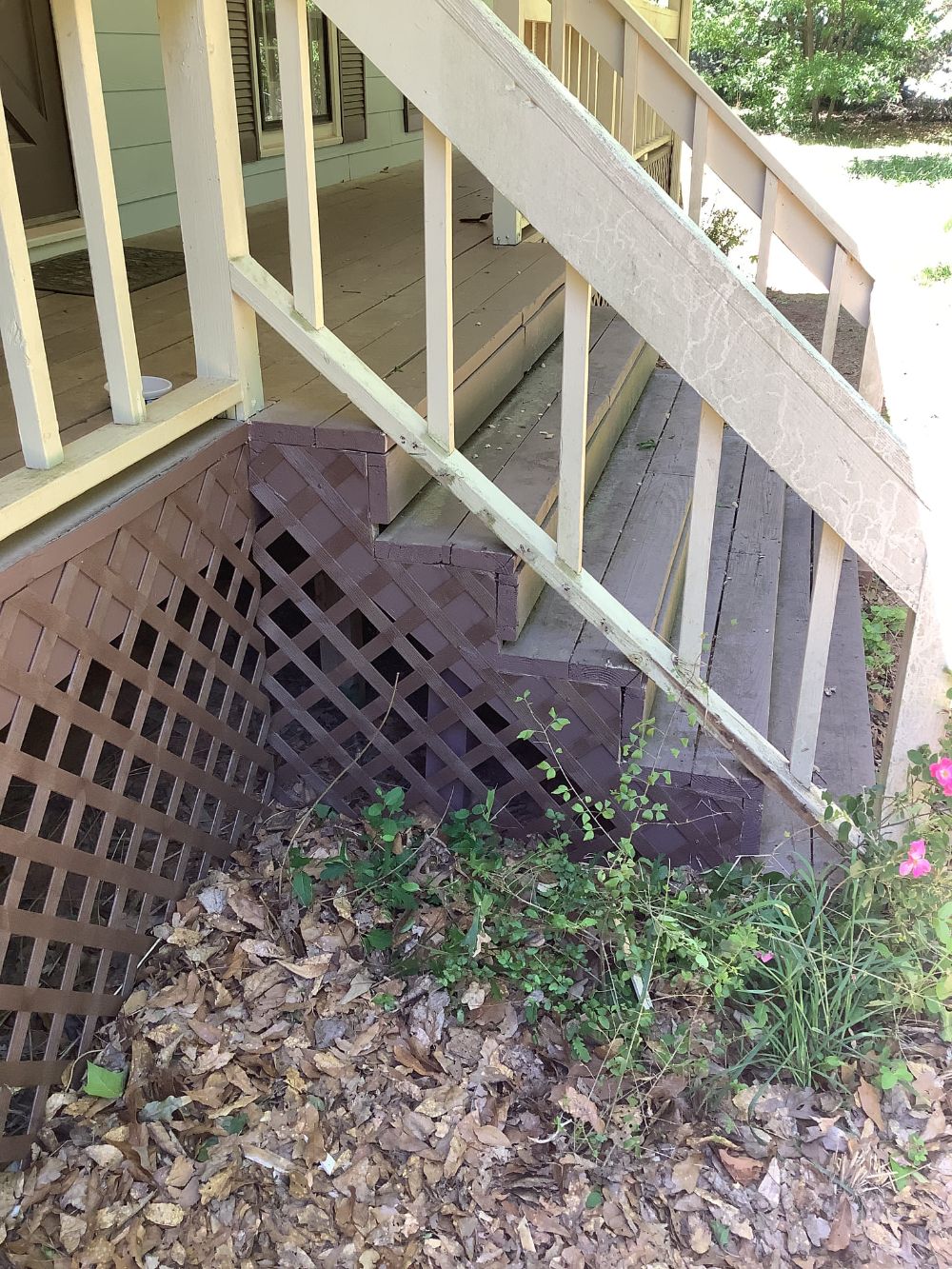 Installed vinyl deck lattice skirting on front porch