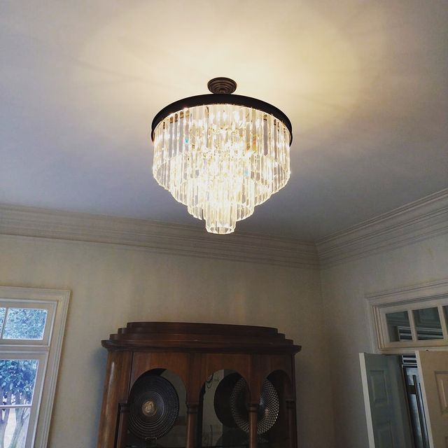 Installed new crystal chandelier in living room