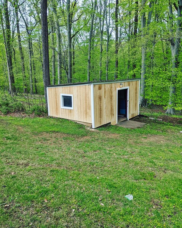 New siding and trim on outbuilding.