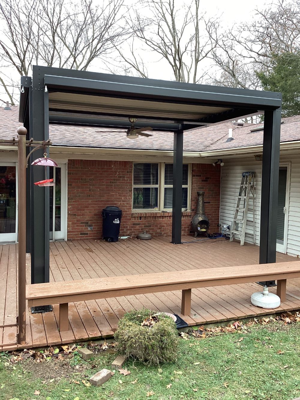 Pergola installation with ceiling and fan