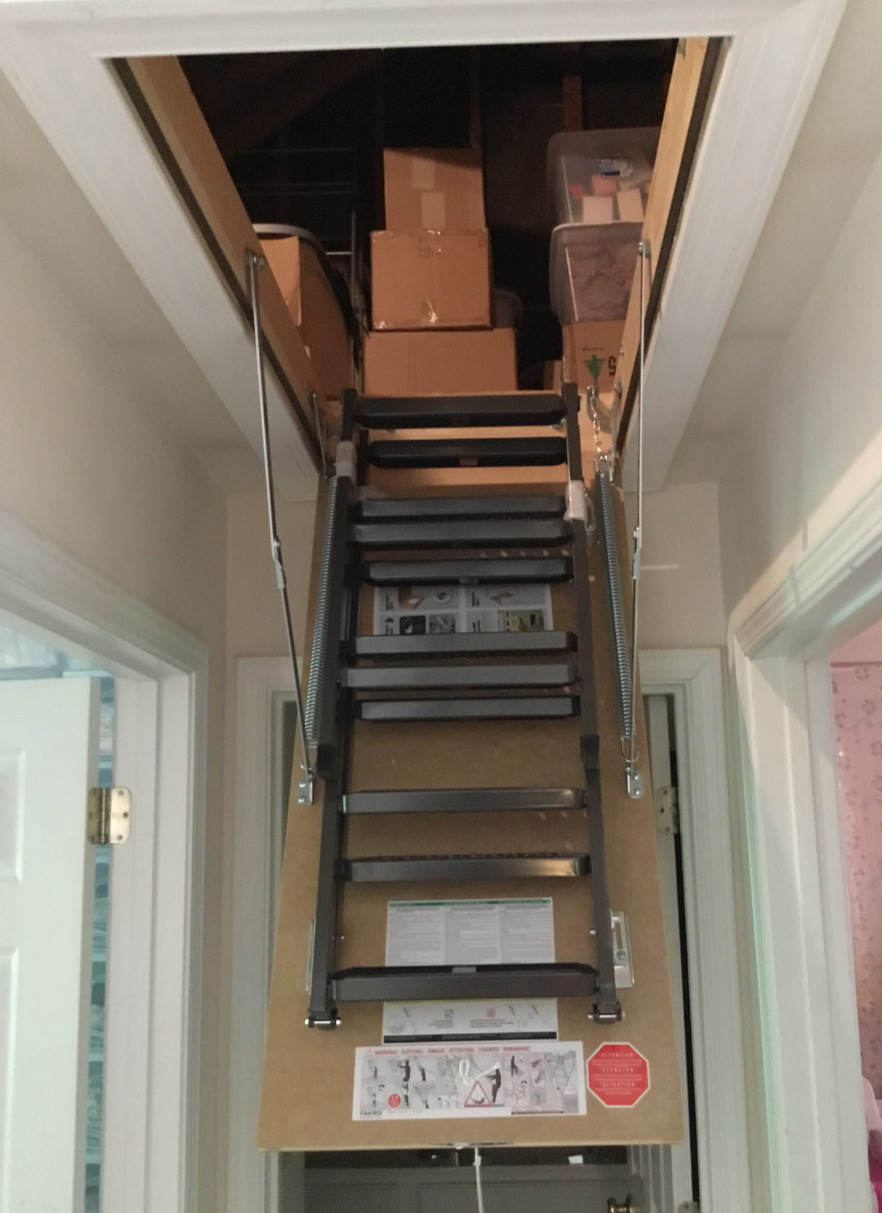 Replace damaged pull down attic ladder with new heavy duty one with metal stairs and insulation.