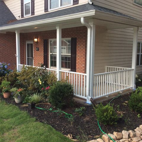 Replaced front porch handrail and pickets