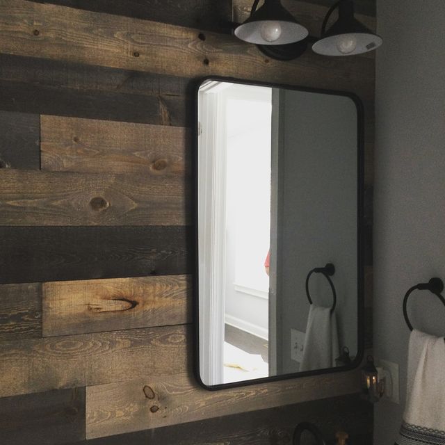 Rustic shiplap wall covering in bathroom and install new mirror.
