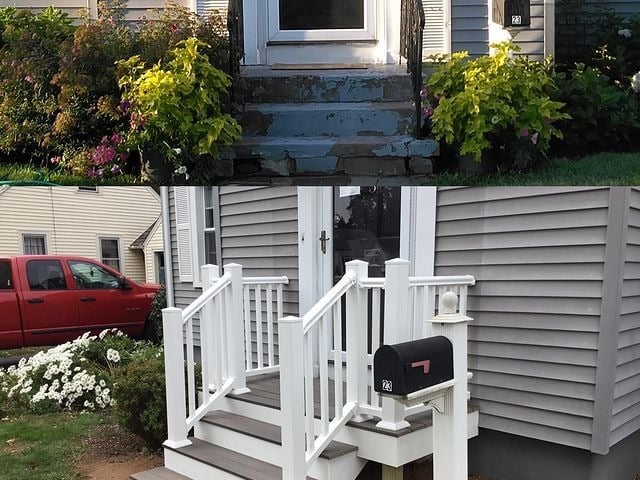 This is the front porch to a home with a set of steps leading up to the front door with a mailbox to the side.