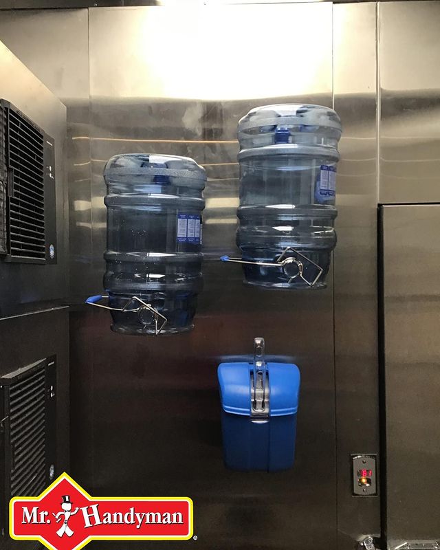 water jugs hung on a wall