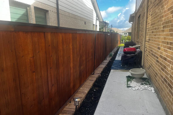 Freshly stained fence after effective Richmond fence repair by Mr. Handyman