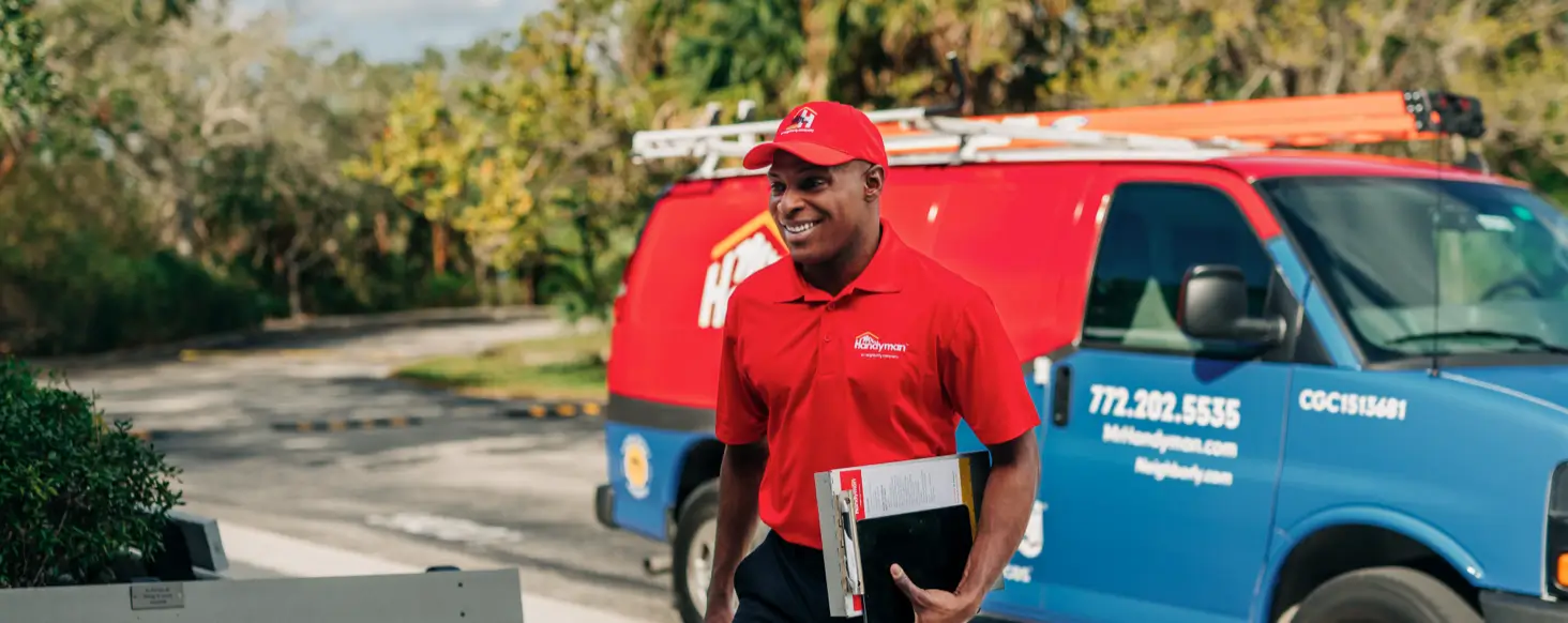 A handyman walks to a job site.