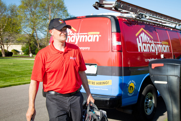 A handyman professional from Mr. Handyman (Oak Brook, IL) arriving for a service appointment.