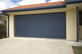 Closed blue garage door.