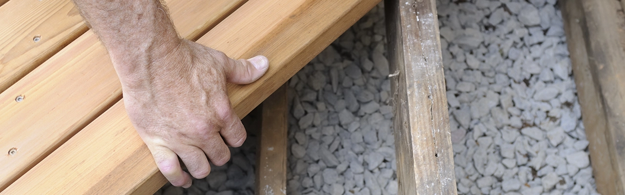 MRH employee aligning deck plank.