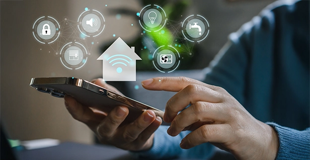 Close-up of a person using a smartphone, with icons for smart home features.
