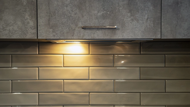 Kitchen wall light under cupboard.