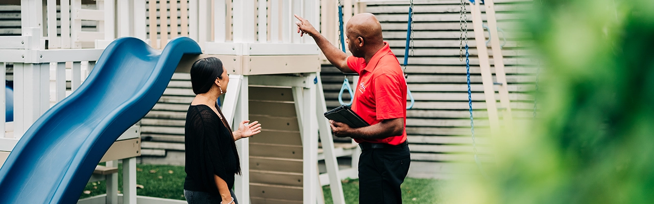 MRH employee explaining the safety features of a playhouse.