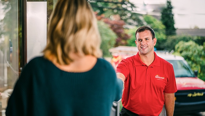 Mr. Handyman technician greeting the customer.