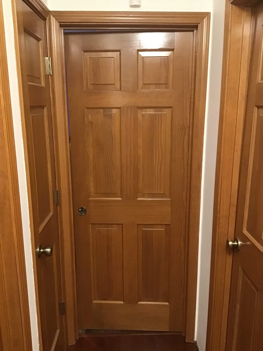 A door at the end of a home&rsquo;s hallway installed with Mr. Handyman&rsquo;s services for door installation in Collinsville, IL.