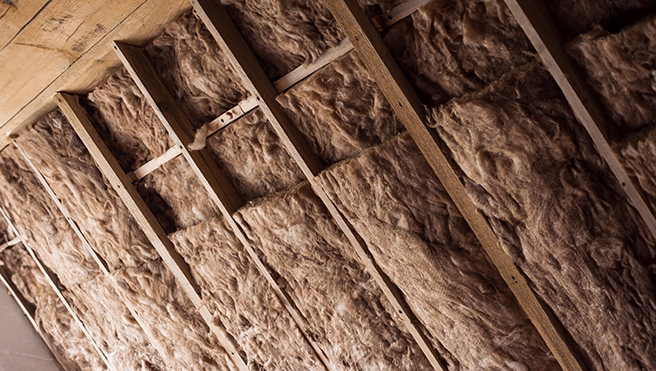 Wooden frame with glass wool.