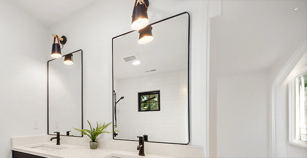 Modern bathroom with dual mirrors.