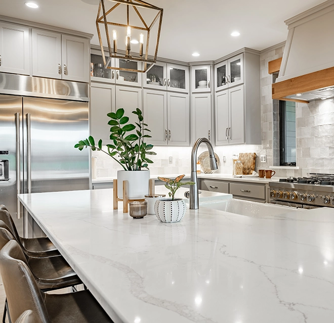Modern kitchen featuring light gray cabinets.