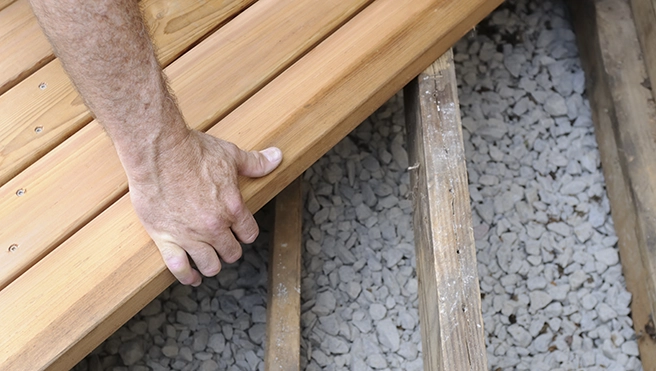 Mr Handyman setting wooden frame.