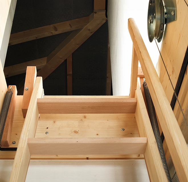View of a wooden staircase leading up.
