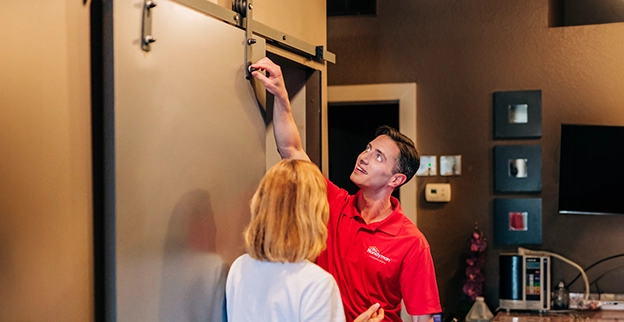 MRH technician showing a door lock.