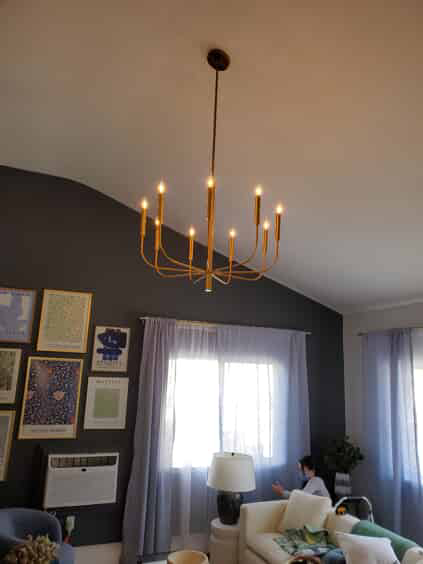 Gold hanging light fixture in living room