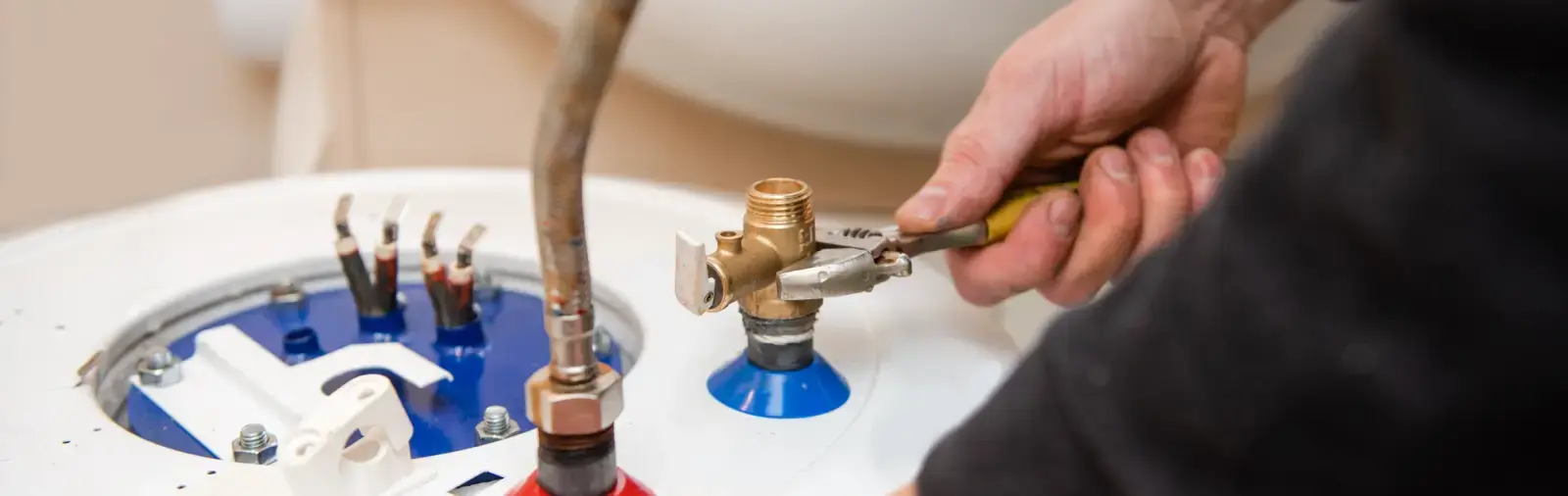 Fixtures being installed on a new water heater.