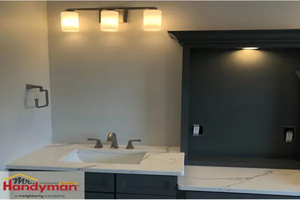 Bathroom vanity with modern triple light fixture installed by Mr. Handyman of Easton, Bethlehem, Nazareth & Allentown.