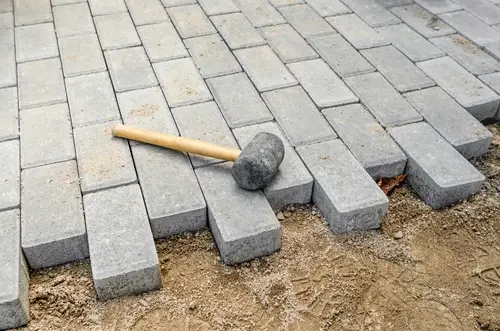 Hammer for sealing a concrete patio.