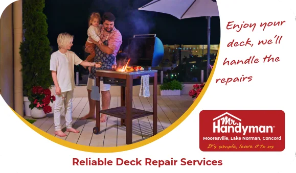 Family grilling together on a backyard deck at night.