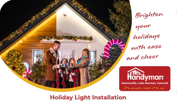 Family standing outside a house decorated with holiday lights.